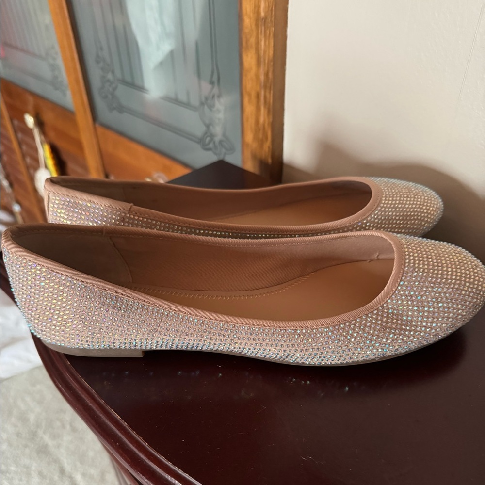 Women’s rose gold beaded flats .